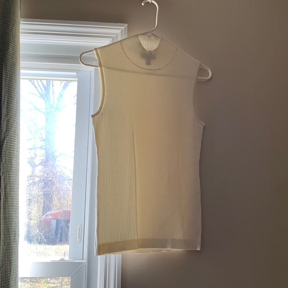 Slightly sheer, cream top